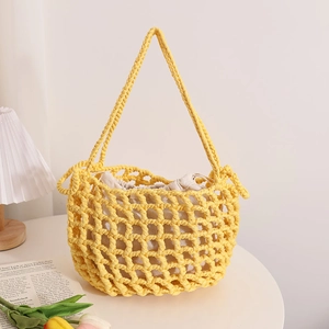 Chic yellow woven mesh tote bag with white drawstring liner for summer beach vacations