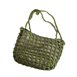 Green woven hollow mesh shoulder bag with beige lining for summer beach vacation