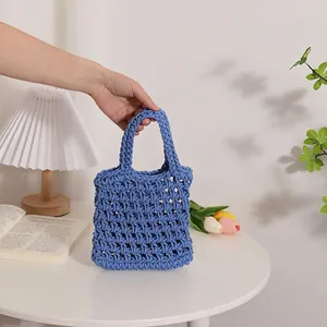 Handmade blue hollow cotton woven handbag with mesh texture for casual summer use