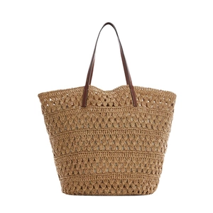 Large capacity woven straw tote bag with brown leather handles on a white background