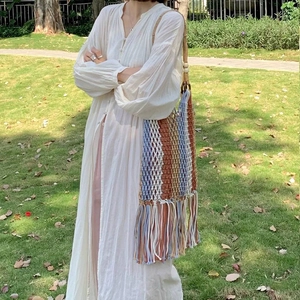 Bohemian style hand-woven cotton shoulder bag with colorful stripes and long fringe tassels