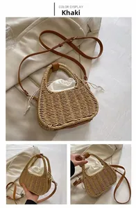 Detail view of khaki straw bag with leather strap and white drawstring lining