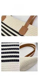 Close-up of striped cotton woven tote bag featuring brown leather handles and stitching