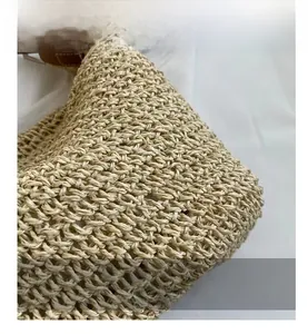 Close-up of beige paper rope weave texture showing the intricate handmade braided craftsmanship