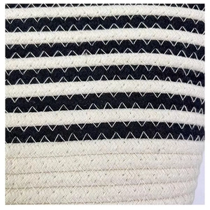 Macro view of black and white striped cotton rope weave with zigzag stitching detail