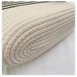 Macro shot of durable off-white cotton rope weaving and stitching on the tote bag