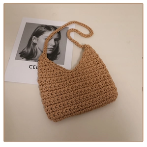 Detailed close-up of khaki woven cotton rope shoulder bag with dense knit texture