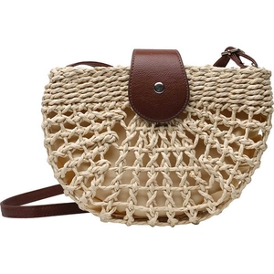 Handwoven semicircular straw crossbody bag with brown leather flap and hollow mesh design