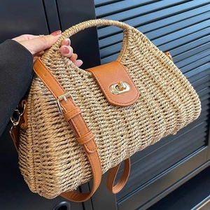 Handmade straw woven shoulder bag with brown leather flap and retro gold twist lock