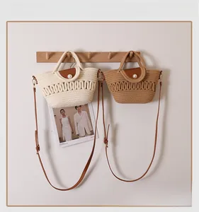 Detailed view of handmade woven beach bags with pearl buckles and leather straps