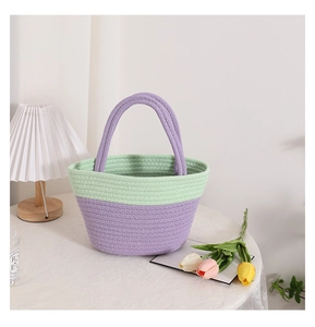 Detail of mint and purple cotton woven handbag on lace tablecloth with tulip background