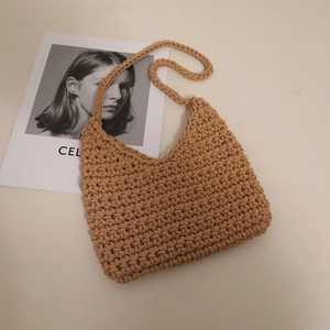 Handmade khaki cotton woven shoulder bag with textured crochet finish for beach vacations