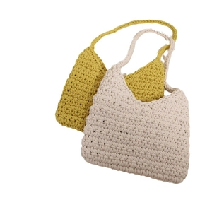 Minimalist cotton woven shoulder bag in cream and mustard yellow for beach vacation