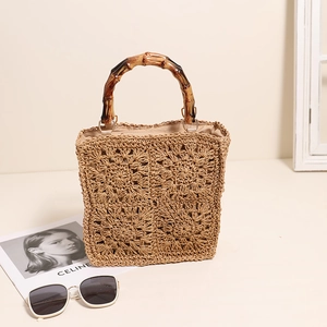 Square crochet straw tote bag with bamboo handles and floral patterns for summer beach wear