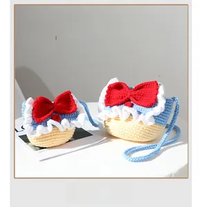 Detailed knit texture of handmade Snow White style crochet bag with red bow accent