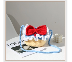 Handmade crochet Snow Princess bag with red bow and blue knit shoulder strap