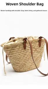 Detail of natural straw woven shoulder bag with leather straps and drawstring inner bag