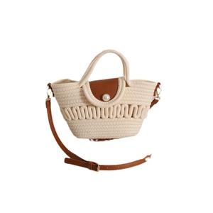 Handmade woven cotton crossbody bag with brown leather flap and large pearl closure