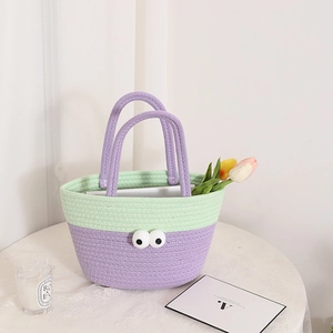 Handmade crochet basket bag with cartoon big eyes and lavender purple woven handles