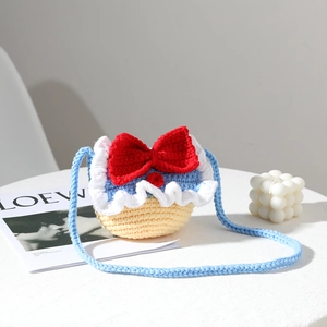 Handmade crochet Snow Princess mini shoulder bag with red bow and colorful knit design