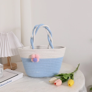 Cute blue and white woven cotton rope handbag with floral decoration for summer picnics