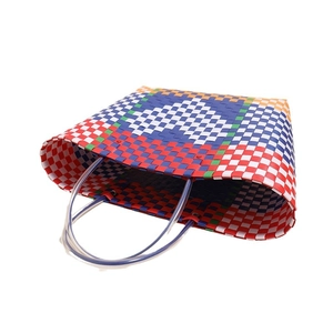 Multicolor woven plastic tote bag with heart pattern and clear dual handles