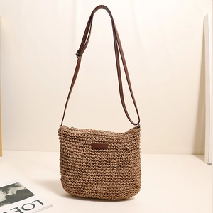 Handmade woven straw crossbody bag with brown leather strap for summer beach beach vacation