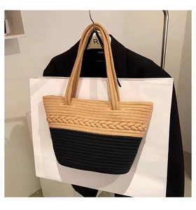 Detailed view of the dual-tone cotton weave on the shoulder tote bag with braided trim