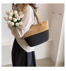 Detail of a large capacity cotton woven tote bag featuring a black and beige bicolor design