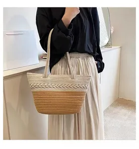 Detail of two-tone woven cotton tote bag with beige braided pattern and brown base