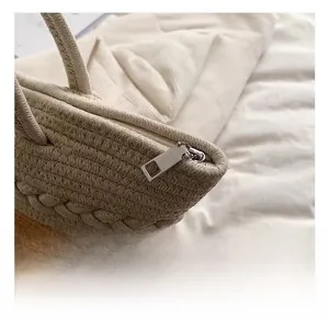 Close-up of high-quality silver metal zipper and woven texture on beach bag