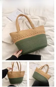 Detail view of large cotton woven tote bag with green and beige color block design