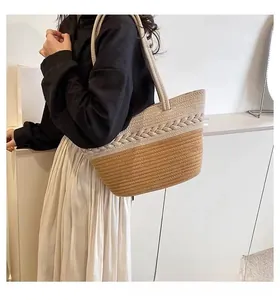 Detail of handwoven two-tone cotton rope tote bag with textured braided patterns