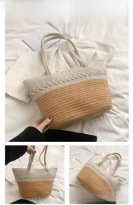 Close-up of khaki and cream woven tote bag showing braided texture and color block design