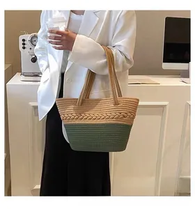 Detail of two-tone woven tote bag with braided texture for beach and casual vacations
