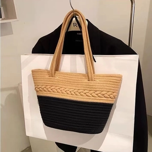 Large color-block cotton woven tote bag with natural and black panels for beach vacation