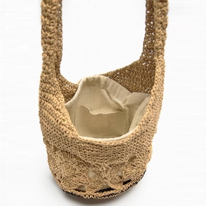 Handmade hollow floral woven bucket bag with cotton lining and long shoulder strap