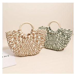 Detailed view of woven straw handbags featuring semicircular design and round handles