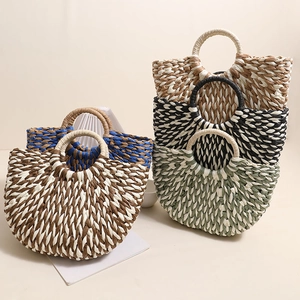 Handmade semi-circular straw handbags in five color variations for summer beach vacations