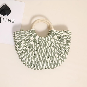 Green and white woven semi-circle straw handbag with round handle for summer holidays