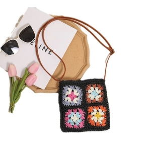 Vintage hollow flower crochet crossbody straw bag with brown strap for beach vacation
