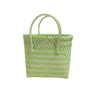 Cute green and white plastic woven beach tote bag with round handles and V-pattern