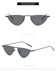 Detail view of small cat-eye triangle sunglasses with black metal frame and lenses
