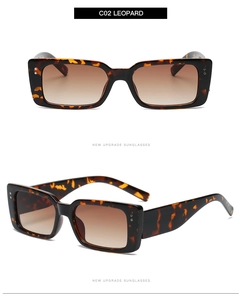Detail of leopard print rectangle sunglasses with brown gradient lenses and silver rivets