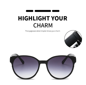Detail of reinforced metal hinges and purple gradient lenses on black sunglasses