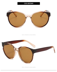 Detail view of brown cat-eye sunglasses with gradient lenses and stylish frames