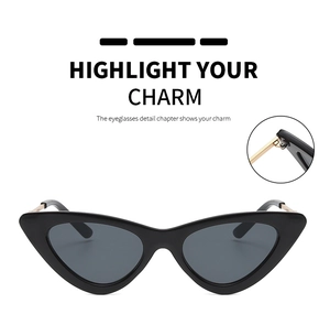 Close-up of durable metal hinge on vintage black cat eye sunglasses with golden temples