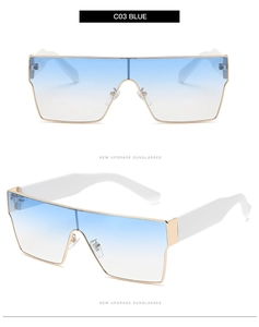 Détail de lunettes de soleil carrées avec verres dégradés bleus C03 et monture dorée