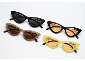 Detail view of cat-eye sunglasses collection in black, amber, and tortoiseshell frames