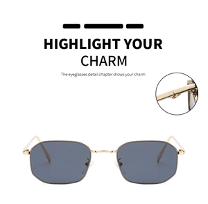 Close-up of golden octagonal metal frame sunglasses with precise hinge craftsmanship